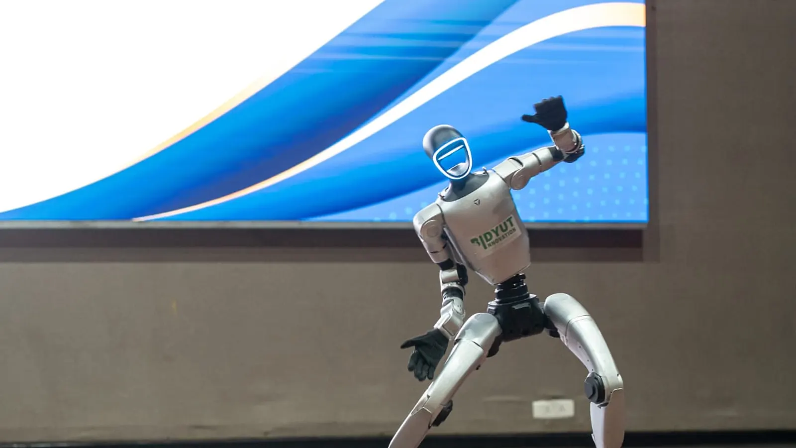 A humanoid robot on stage at an exhibition
